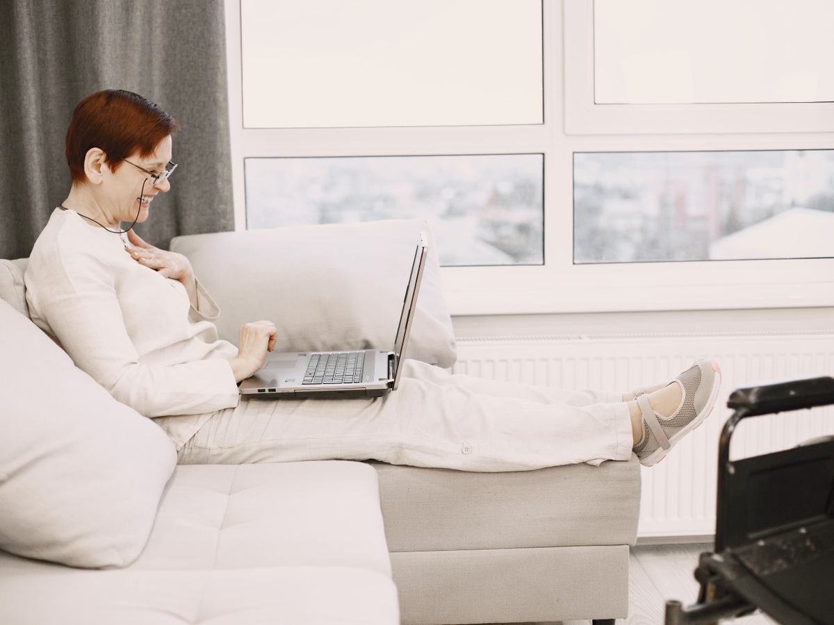 A person smiling during an online visit